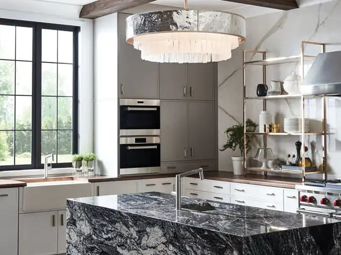 Kitchen with marble counters and dramatic ovberhead lighting