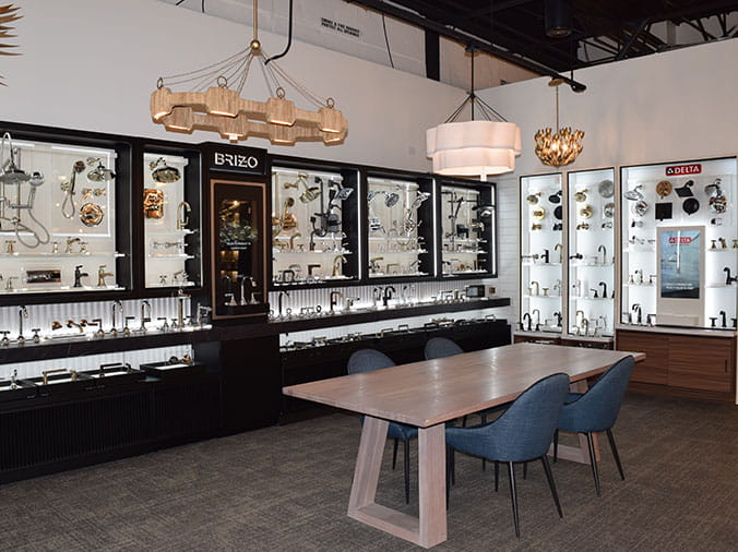 Gooseneck kitchen sink faucets display in the Facets of Charlotte Kitchen & Bath Showroom